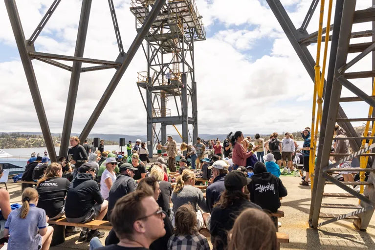 Crowd watching the competition beneath the old mill loading tower